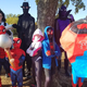 A family dressed up as various characters from Spider-Man: Into the Spider-Verse, including Doc Ock, Spider-Man Noir, Spider-Gwen, Spider-Ham, Prowler, and Miles Morales.